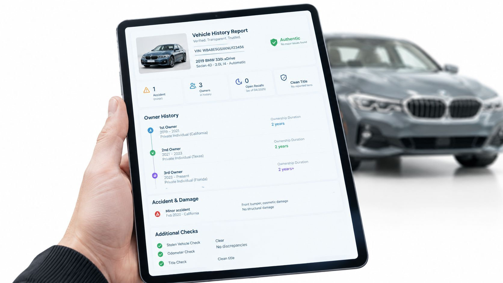 A hand holding a tablet displaying a detailed digital vehicle history report for a BMW sedan.